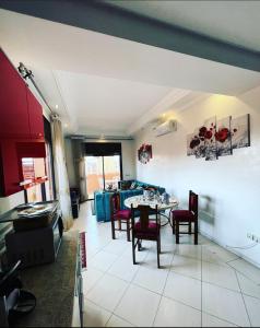 a living room with a table and chairs at Nice apartment in the city center in Marrakech