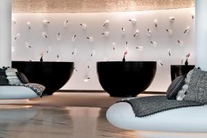 a room with two black bowls on the wall at W Abu Dhabi - Yas Island in Abu Dhabi