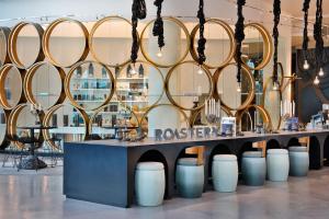 a room with a table with a bunch of mirrors at W Abu Dhabi - Yas Island in Abu Dhabi
