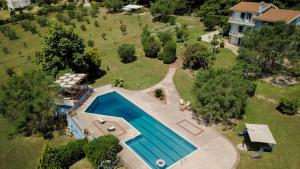 an aerial view of a house with a swimming pool at Olivos Villa Sani in Sani Beach