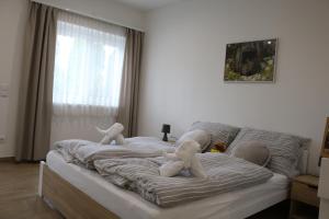 Postel nebo postele na pokoji v ubytování Rezeda Vendégház