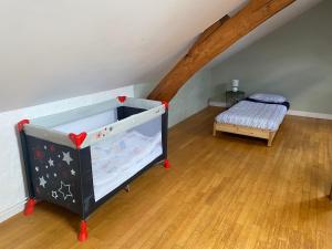 En eller flere senge i et værelse på Chez Myriam