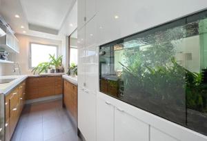 a large fish tank in a kitchen with a large aquarium at Full apt - Top floor - Eiffel Tower Panoramic View in Issy-les-Moulineaux