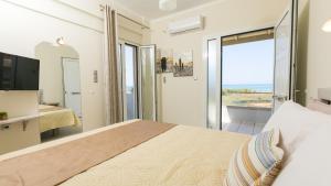 Postel nebo postele na pokoji v ubytování Vasileios Seaview Apartments