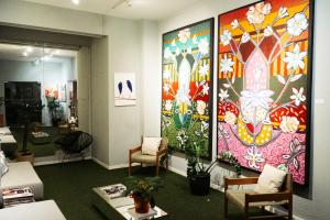 a room with a large painting on the wall at Cris Hotel in Florianópolis