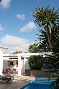 a view of a house with a swimming pool at Casa Mila with heated pool in El Roque in Cotillo