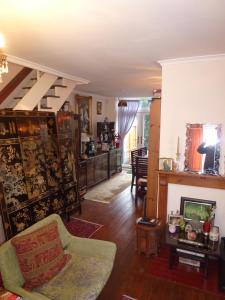 a living room with a couch and a fireplace at House o' Books in London