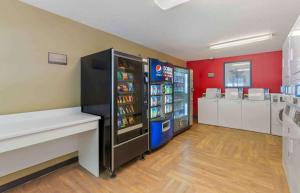 a convenience store with a soda machine in a room at Extended Stay America Suites - Greensboro - Wendover Ave - Big Tree Way in Greensboro