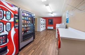 a room with a coca cola machine in a store at Extended Stay America Suites - Oklahoma City - Airport in Oklahoma City