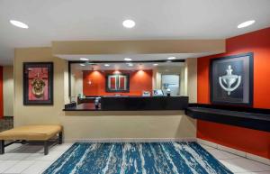 a hotel lobby with a waiting area and a mirror at Extended Stay America Suites - Oklahoma City - NW Expressway in Oklahoma City