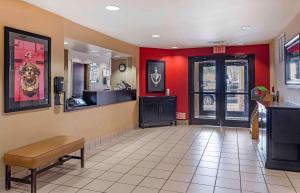 a waiting room at a fast food restaurant with red walls at Extended Stay America Suites - Amarillo - West in Amarillo