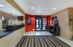 a large room with red walls and aoyer with at Extended Stay America Suites - Cleveland - Brooklyn in Brooklyn