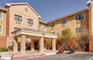 a building with two motorcycles parked in front of it at Extended Stay America Suites - Laredo - Del Mar in Laredo