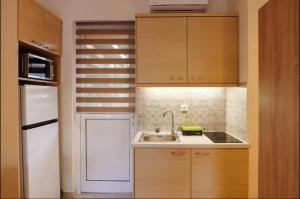 Marathon Luxury Suites - Studio tesisinde mutfak veya mini mutfak