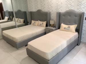 Un pat sau paturi într-o cameră la Hotel Blue Malecón And Spa