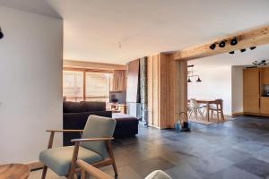 a living room with a couch and a table at Ambassador 103 in Verbier