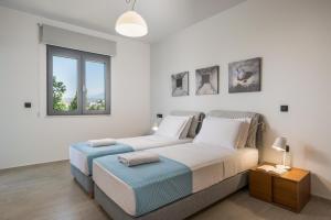 A bed or beds in a room at Elysium Seaview Oasis