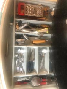 a drawer filled with lots of kitchen utensils at Hyper centre - Balcon / Parking in Le Havre