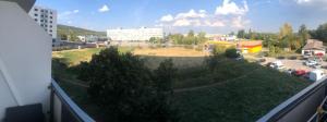 a view of a parking lot from a balcony at Meri apartment in Rača