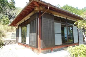 a small house with a black and white exterior at Bob's house - Vacation STAY 42876v in Kameoka