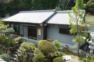 a small house with a garden in front of it at Bob's house - Vacation STAY 42876v in Kameoka