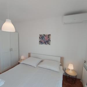 Postel nebo postele na pokoji v ubytování Apartment MONAS III