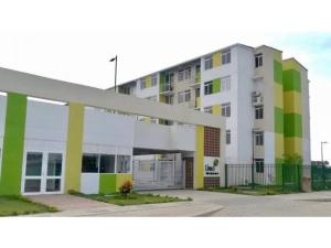 a large white building with colorful squares on it at Apto Conjunto Residencial Lima in Montería