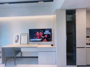 TV a/nebo společenská místnost v ubytování Canopy Executive Apartments - Liuxian Cave Headquarters