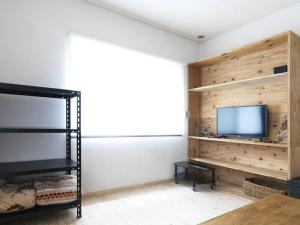 TV o dispositivi per l'intrattenimento presso Renewal Open! 【urban’s camp fuji】ウッドデッキでBBQ可！新装別荘！