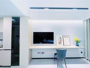 TV a/nebo společenská místnost v ubytování Canopy Executive Apartments - Liuxian Cave Headquarters