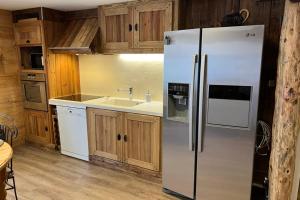 a kitchen with a refrigerator and a sink at La Dorbluche apartment 4-6 person in Longefoy