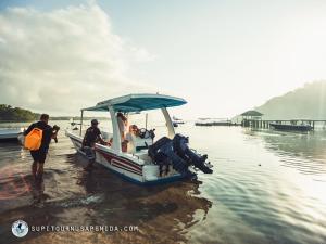 a group of people on a boat in the water at Seven Angels Villa and Hostel in Nusa Penida