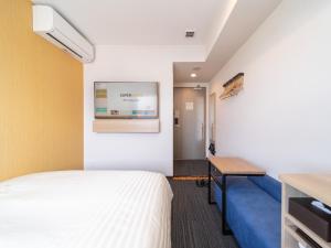 Postel nebo postele na pokoji v ubytování Super Hotel Yahaba Station East Exit