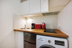 Kuchyňa alebo kuchynka v ubytovaní Cosy apartment - 1BR-3P - Arc de Triomphe