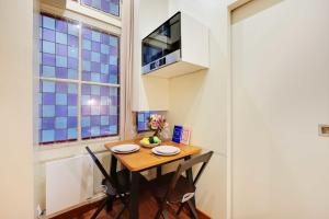 Televízia a/alebo spoločenská miestnosť v ubytovaní Cosy apartment - 1BR-3P - Arc de Triomphe