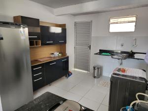 a kitchen with a stainless steel refrigerator in it at Linda casa no Alvorada II in Parnaíba