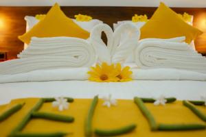 a cake with towels on top of a table at Iora Resort Habarana in Habarana