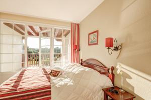 Ein Bett oder Betten in einem Zimmer der Unterkunft Résidence Pierre & Vacances Le Domaine de Gascogne