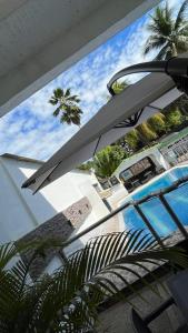 a view of a swimming pool from inside a building at Hotel Quinta Ana María in Melgar