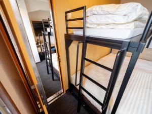 Postel nebo postele na pokoji v ubytování Super Hotel Yahaba Station East Exit
