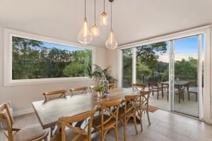 a dining room with a table and chairs at Lakes Edge in Daylesford