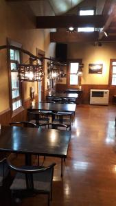 a row of tables and chairs in a large room at Bistare Kana in Niseko