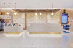 Лобі або стійка реєстрації в Xinhuating Business Hotel