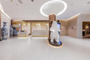 Лобі або стійка реєстрації в Xinhuating Business Hotel