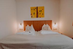 Łóżko lub łóżka w pokoju w obiekcie Sporthotel Kitz inkl Sommercard, kostenlose Maut für die Großglockner Hochalpenstraße, zentrale Lage mit bestem Ausblick