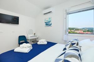 a bedroom with a bed and a window at Mia Maria Apartment in Cavtat +28 photos