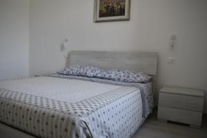 En eller flere senger på et rom på Casa I Guazzi