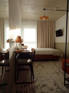 Postel nebo postele na pokoji v ubytování Arche Hotel Wrocław Airport