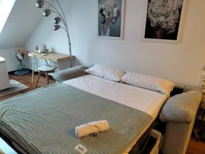 a living room with a couch and a table at Atico Martina Centro in Gijón