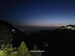 a view of the city lights at night at Peaceful Dalhousie in Dalhousie